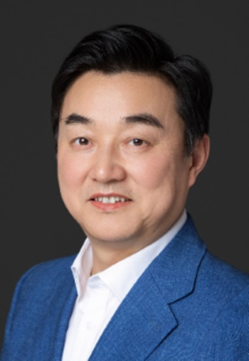 smiling man in white shirt and blue dress jacket