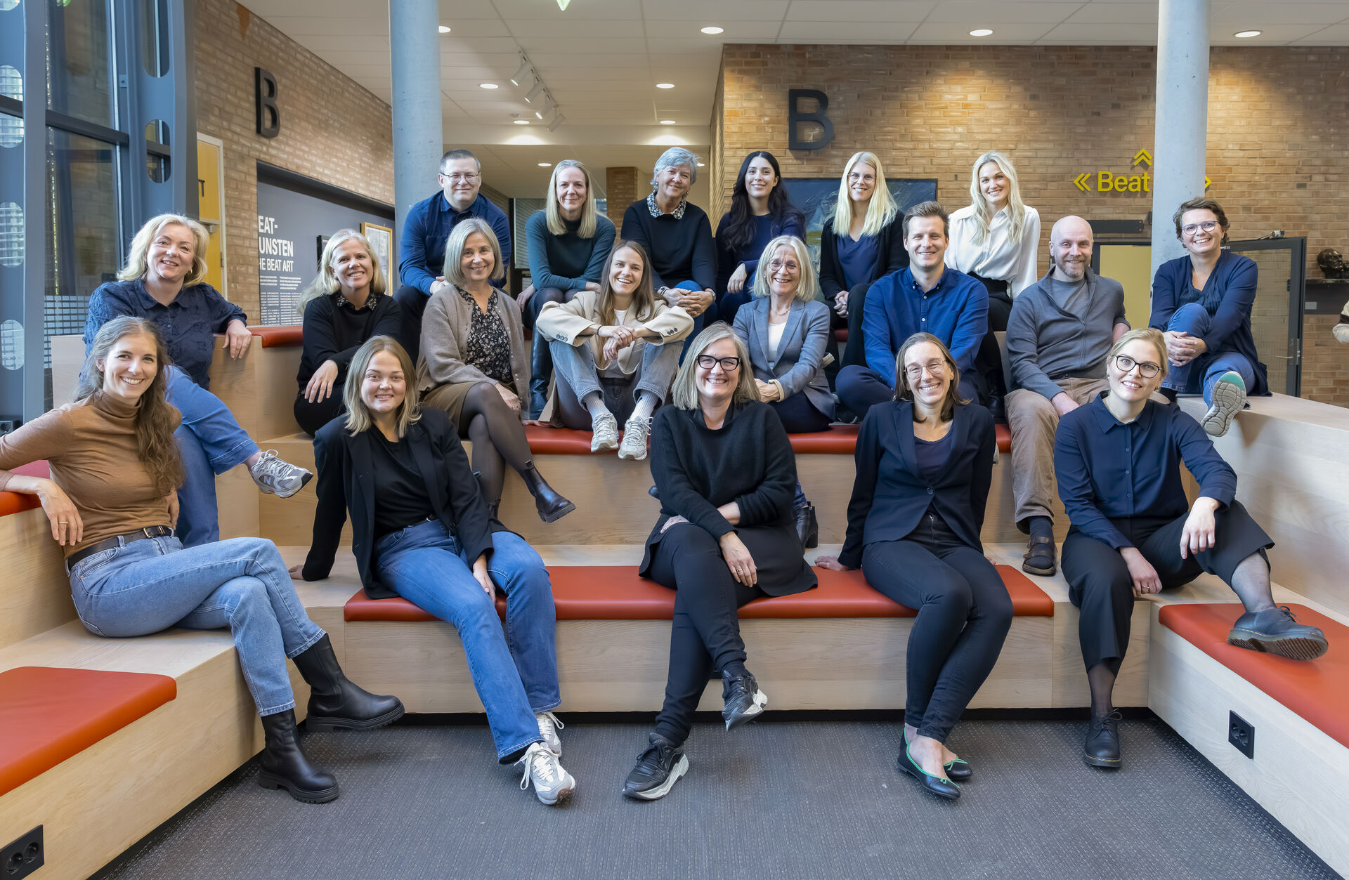 A picture of all members of the centre, photographed in the halls of UiA campus Kristiansand.