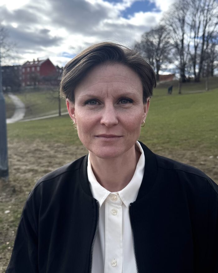 A profile picture of the candidate clothed in a white blouse and black jacket