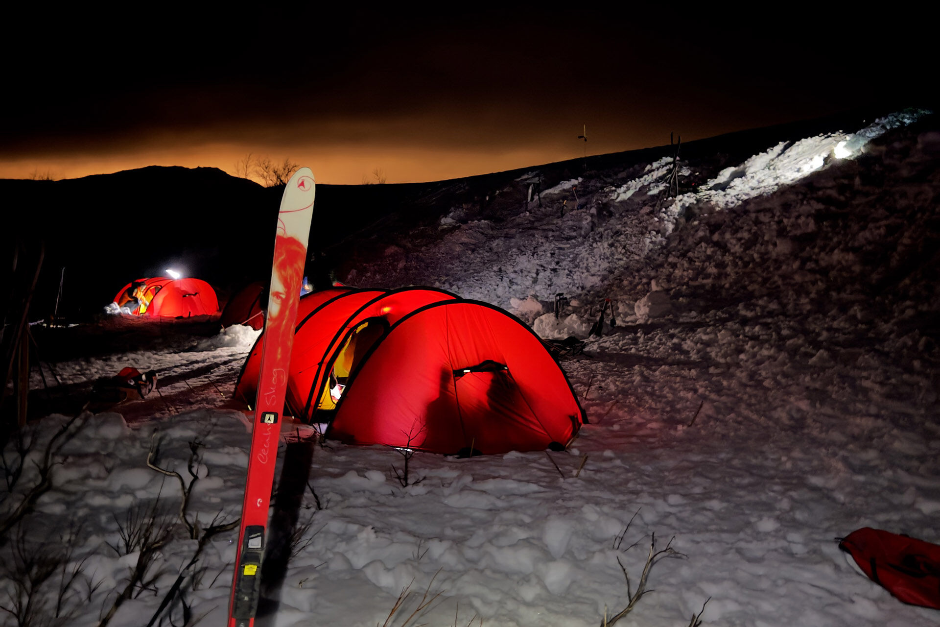 Image may contain: Red, Camping, Tent, Winter, Snow.