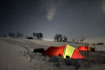 Image may contain: Sky, Atmosphere, Tent, Snow, Tree.