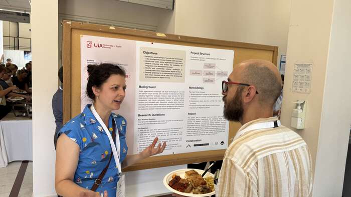 Image may contain: Person, Hair, Job, Conversation, Poster session.