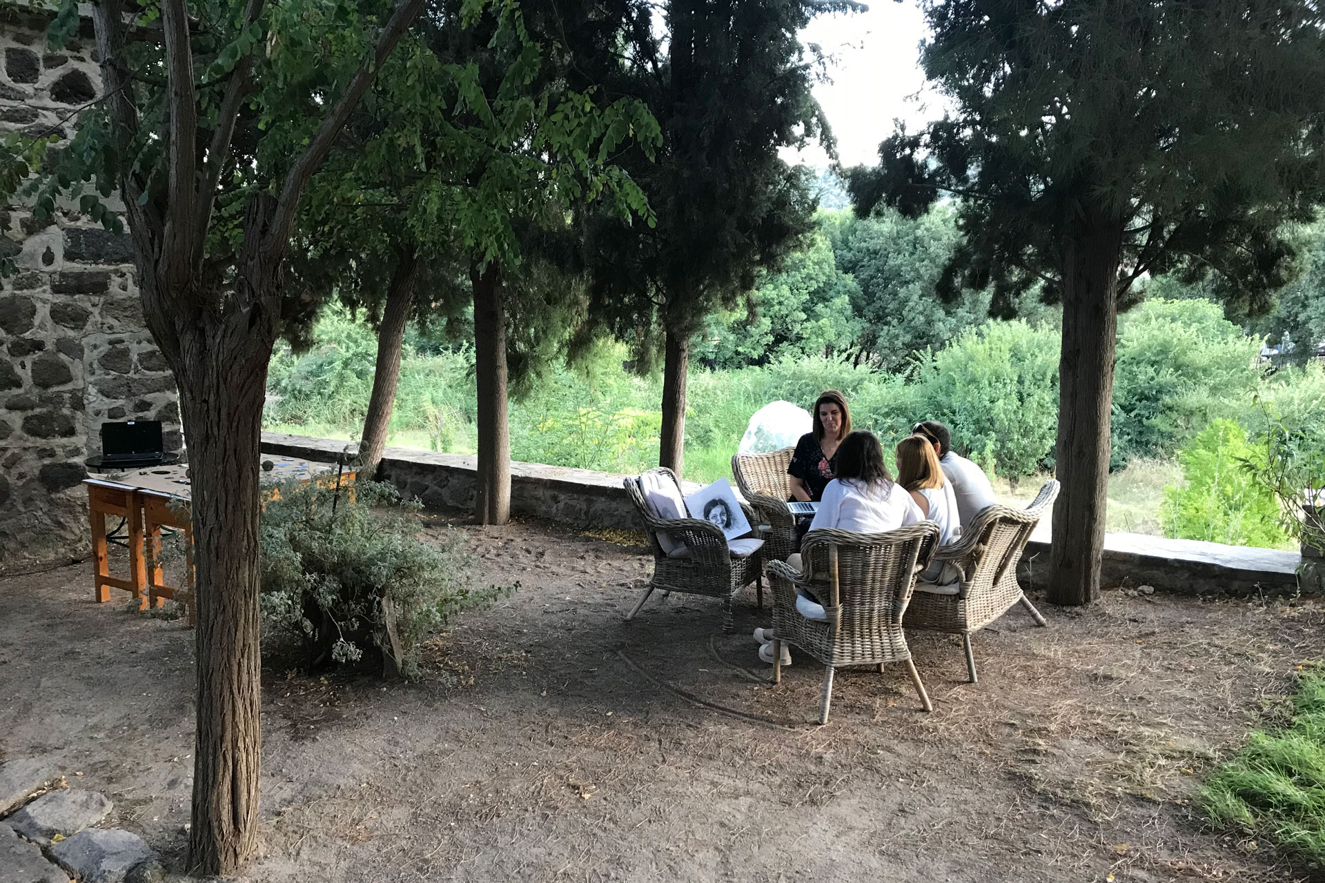 Photo of students working together outside on Metochi