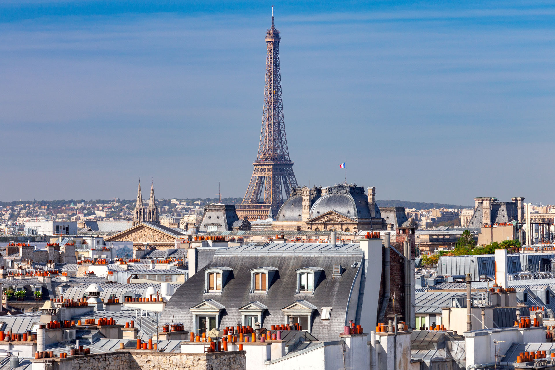 Photo showing roof tops looking towards the Eiffel tower in Paris