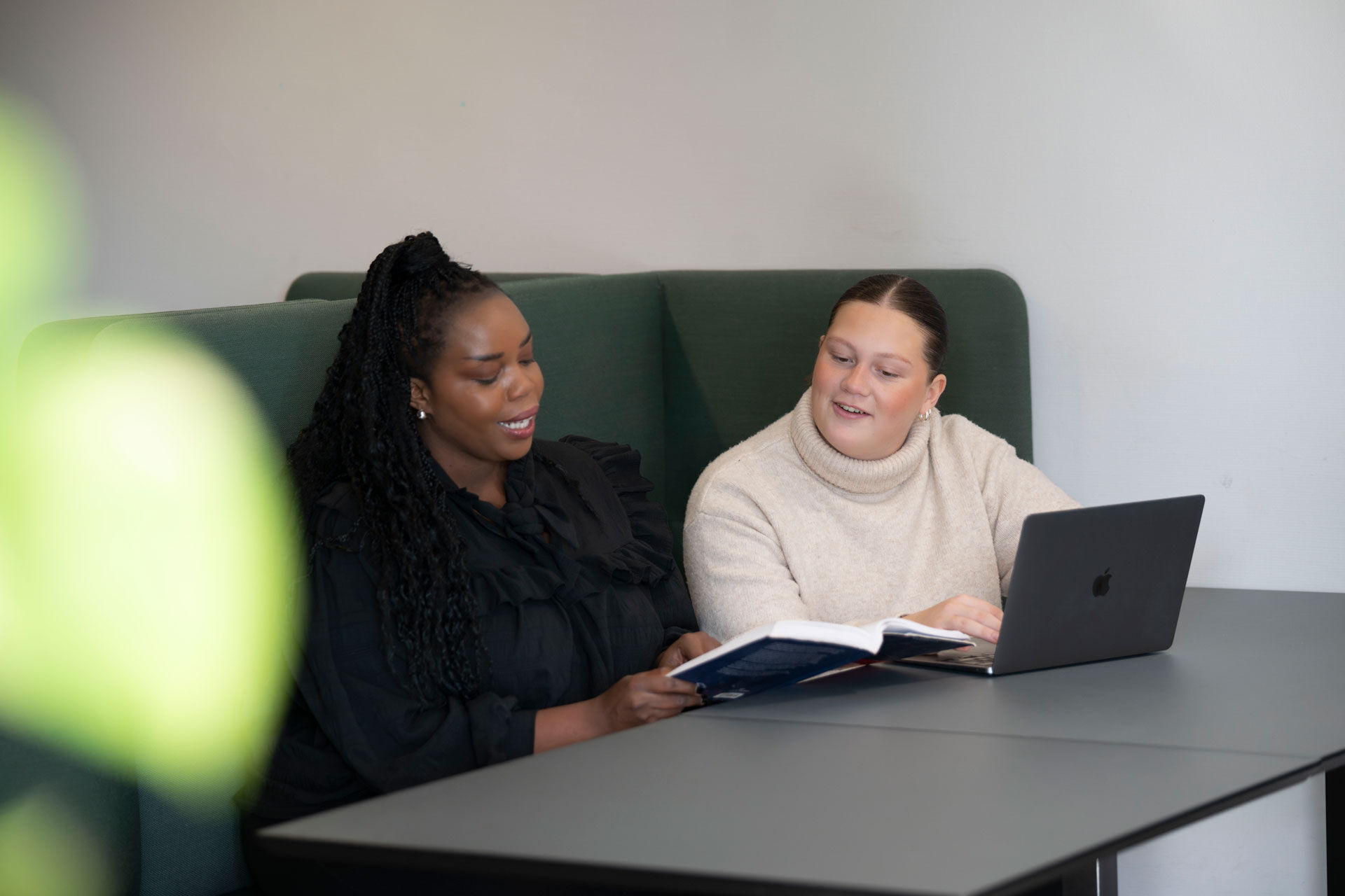 Photo of two students working together