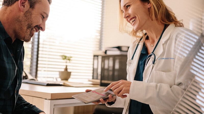 Photo of a man consulting with a doctor