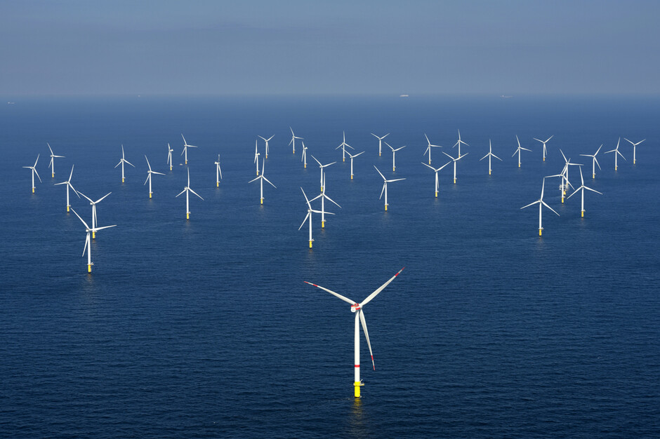 Image may contain: Water, Windmill, Wind farm, Sky, Natural landscape.