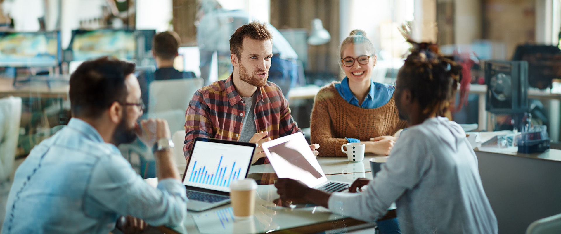 A group of four working together, statistics, computers