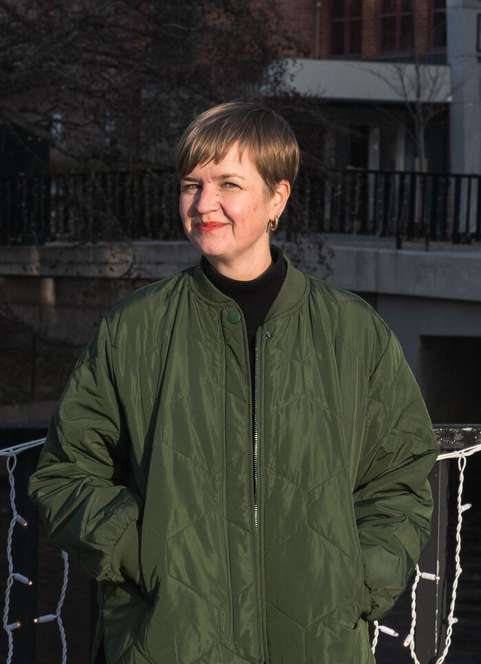 A profile picture of the candidate clothed in a green jacket