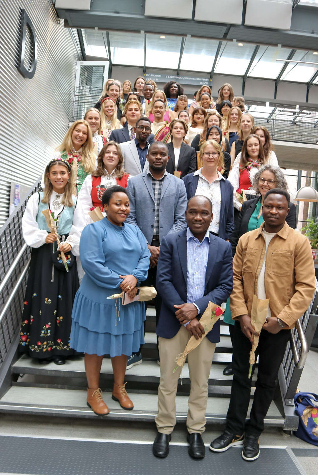 Group of people smiling to the camera