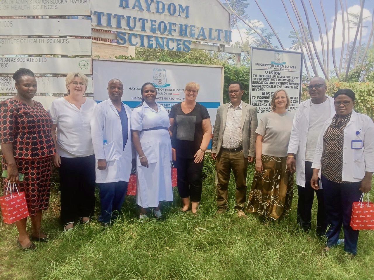 People in front of the hospital sign