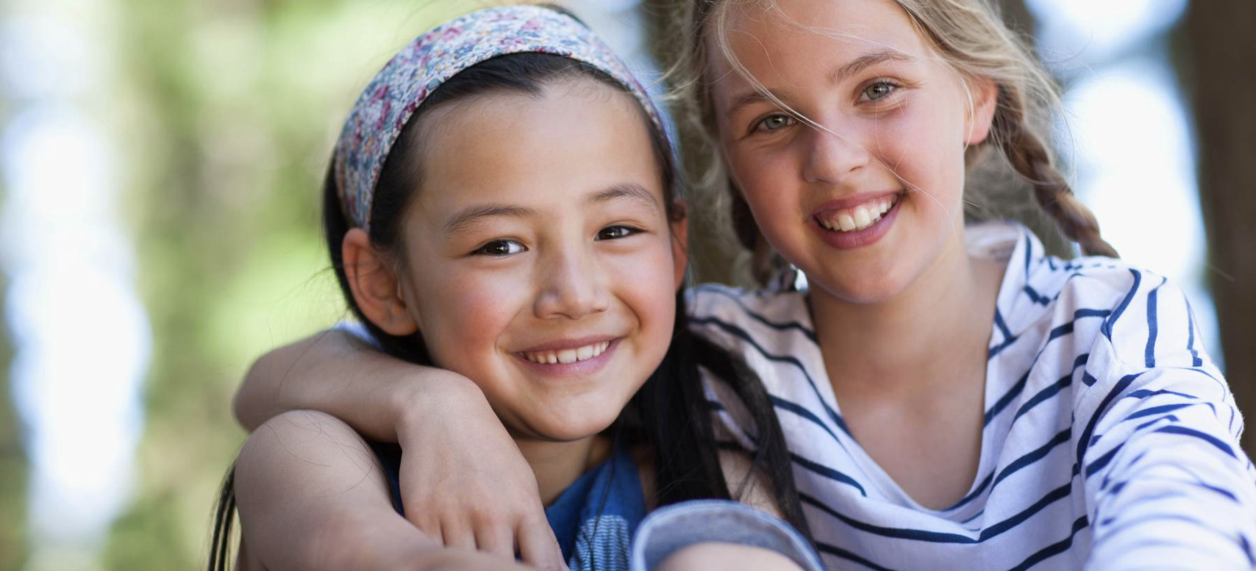 Portrait of two girls from middle school smiling