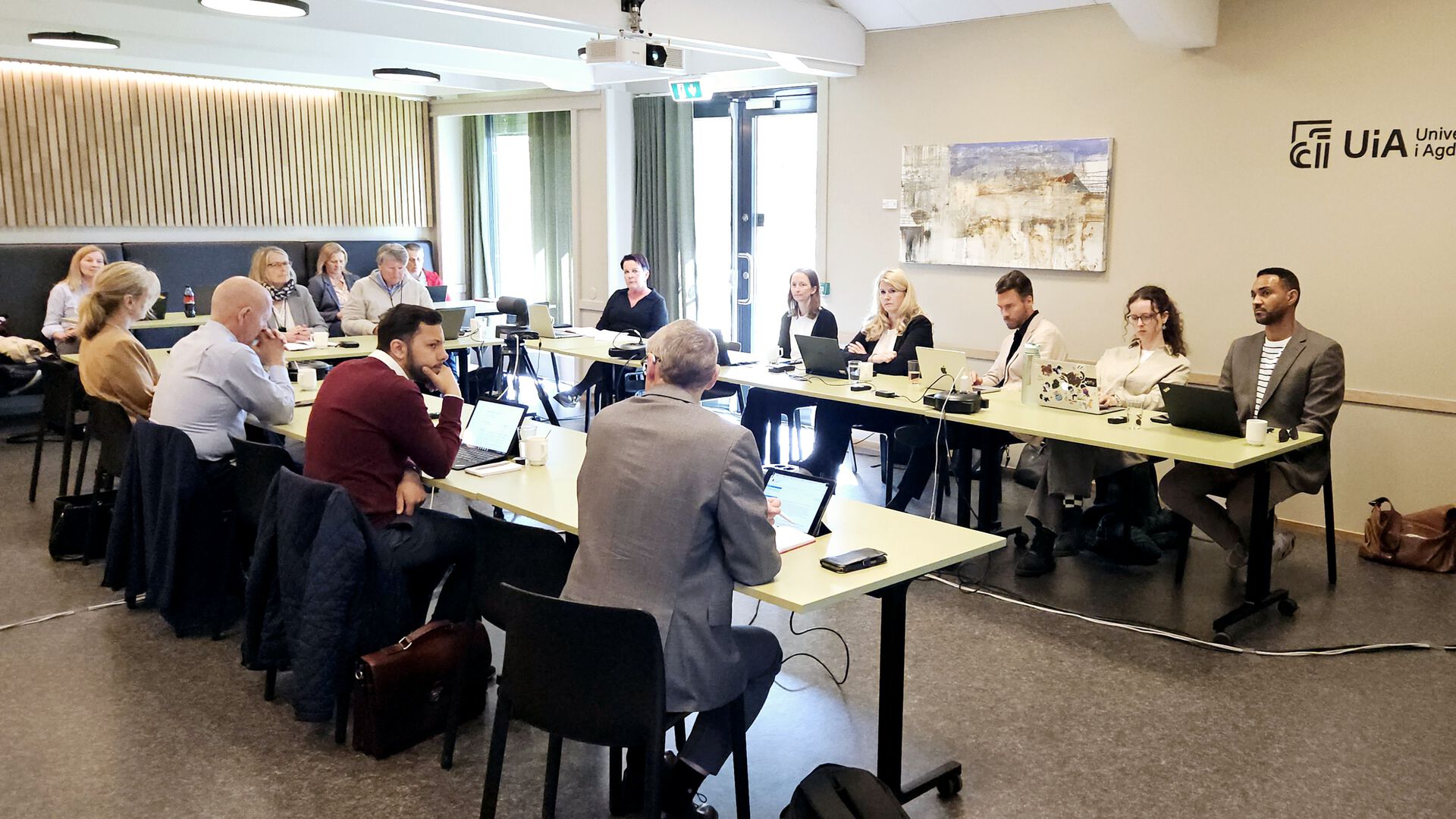 University Board members gathered around a table