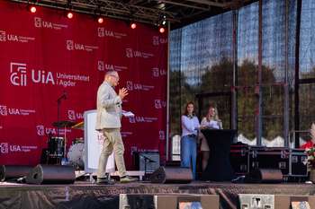 Image may contain: Audio equipment, Electronic device, Stage, Public address system, Microphone.
