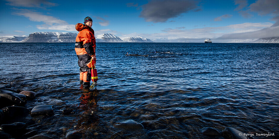 Photo showing researcher at fieldwork by the sea