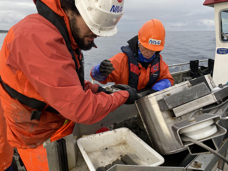Researchers in a boat at sea